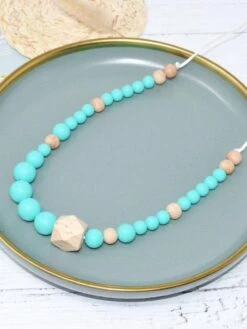 Kiabi -Kiabi collier dallaitement ou de portage en silicone turquoise et bois bleu turquoise aqa69 1 frb2